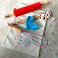 Load image into Gallery viewer, Baking tools including a red rolling pin, wooden cookie cutter, and whisk on a towel with 'Mumz Little Chefs' text.
