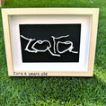 Load image into Gallery viewer, Framed artwork with 'LOVE' and 'Zara 4 years old' on a grass background