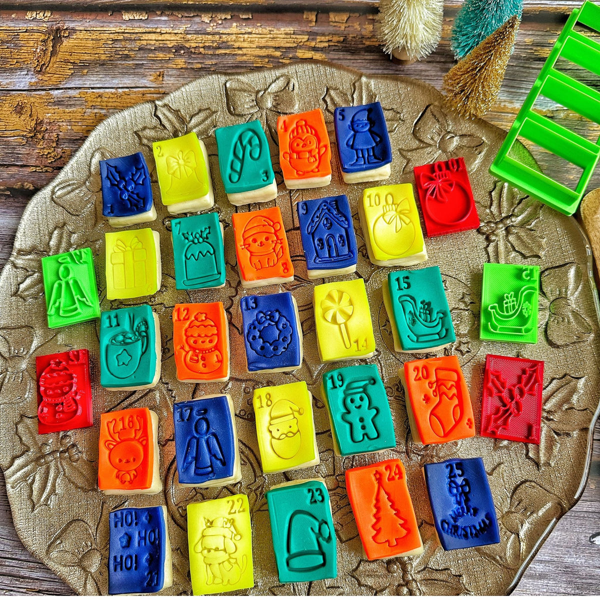 Set of 25 colourful 3D printed Christmas advent calendar cookie stamps pressed into dough, made in Dubai
