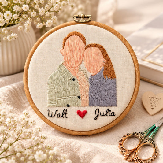 Hand embroidered couple portrait hoop with names Walt and Julia and a red heart, custom made in Dubai