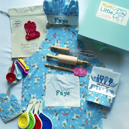 a personalised baking kit for kids including personalised apron, chef hat and matching glove with personalised spatula rolling pin and whisk