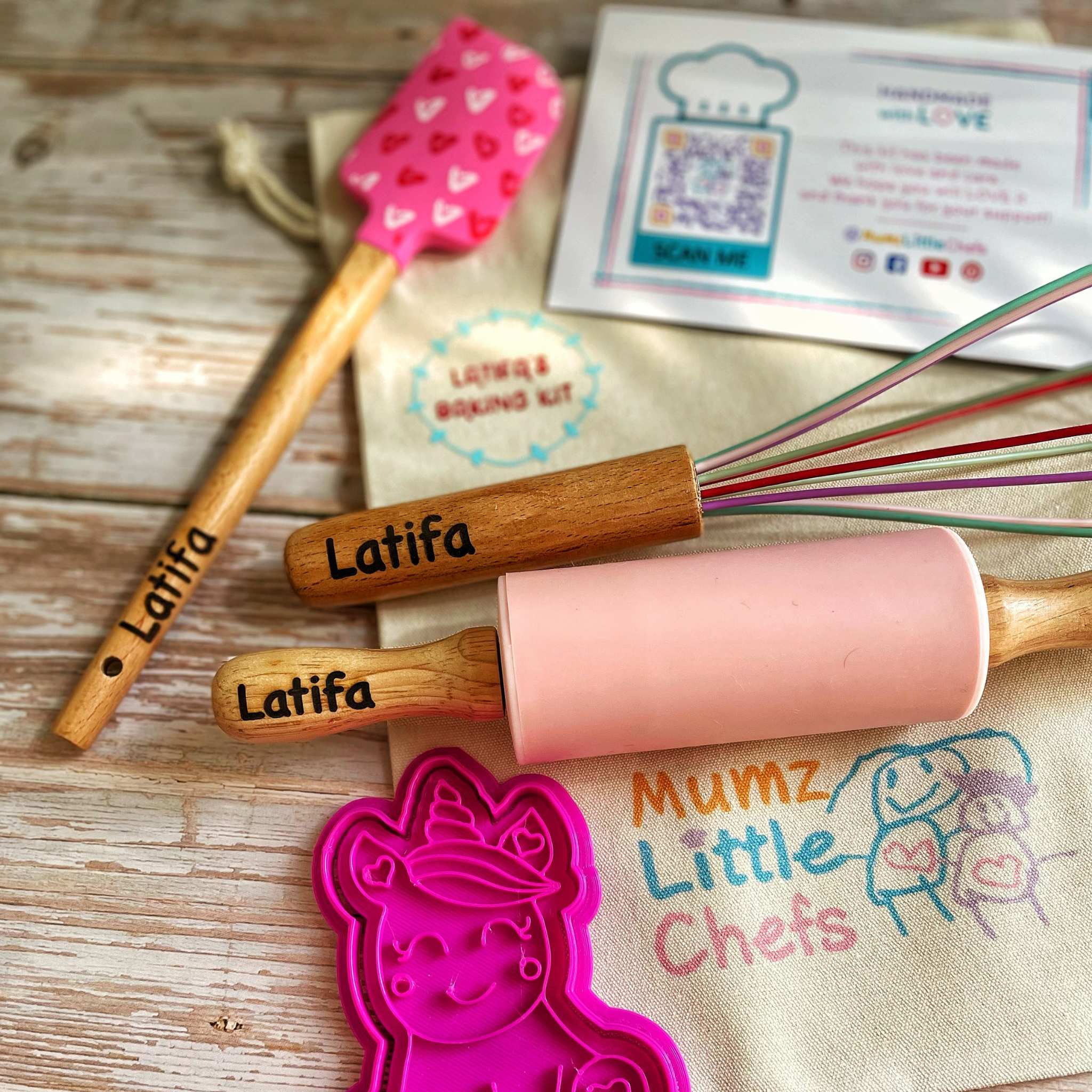 Baking tools with 'Latifa' branding on a wooden surface, including a pink rolling pin and spatula.
