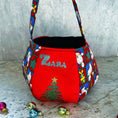 Load image into Gallery viewer, Personalised Santa treat pouch with a child's name in festive fabric, made in Dubai
