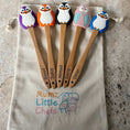 Load image into Gallery viewer, Five wooden spoons with cartoon character handles on a 'Mumz Little Chefs' branded towel.
