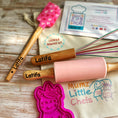 Load image into Gallery viewer, Baking tools with 'Latifa' branding on a wooden surface, including a pink rolling pin and spatula.

