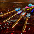 Load image into Gallery viewer, Set of wooden spoons with colorful owl handles on a wooden surface.
